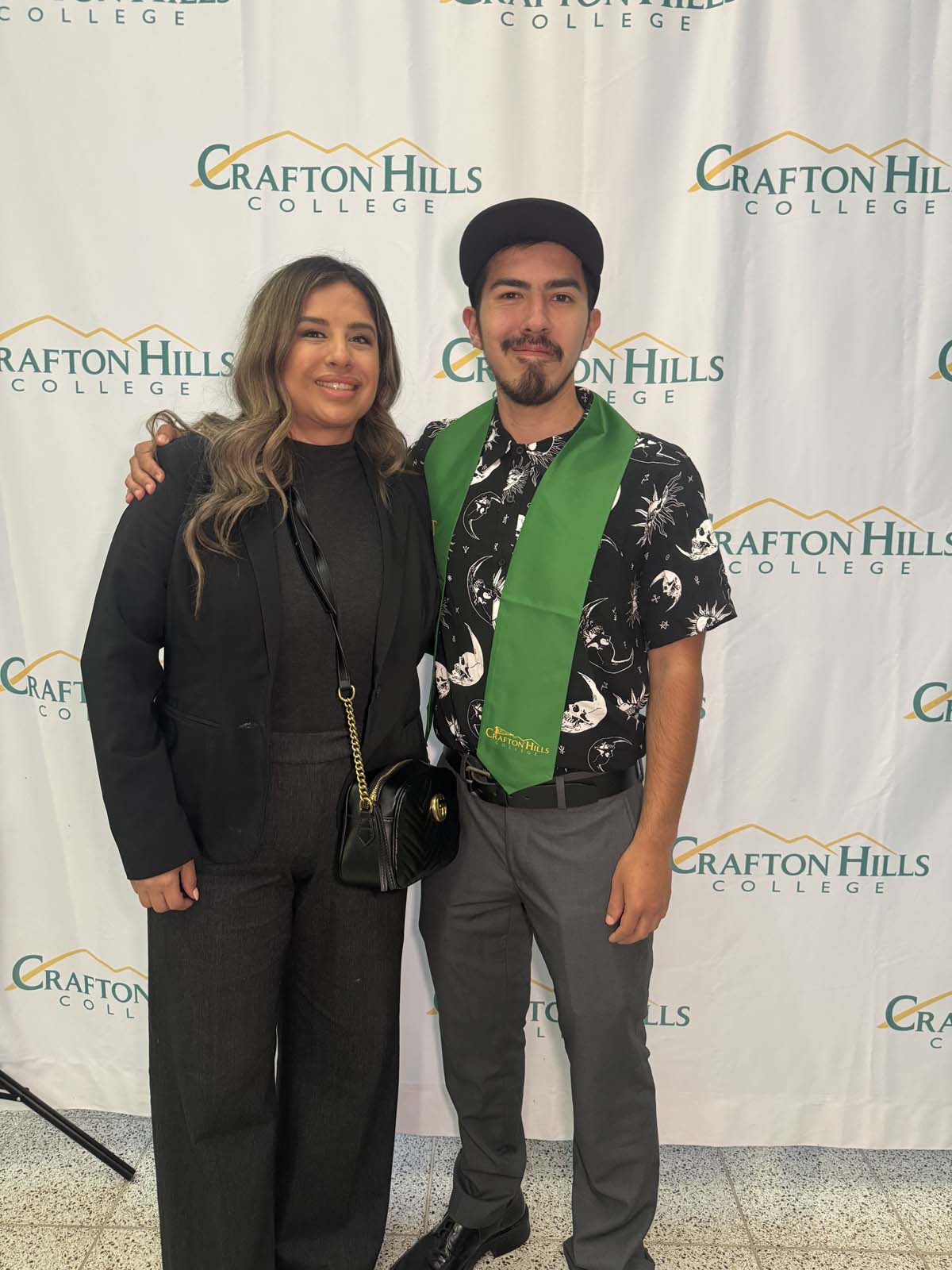 Students attend Transfer Dinner celebration with mascot Ryker.