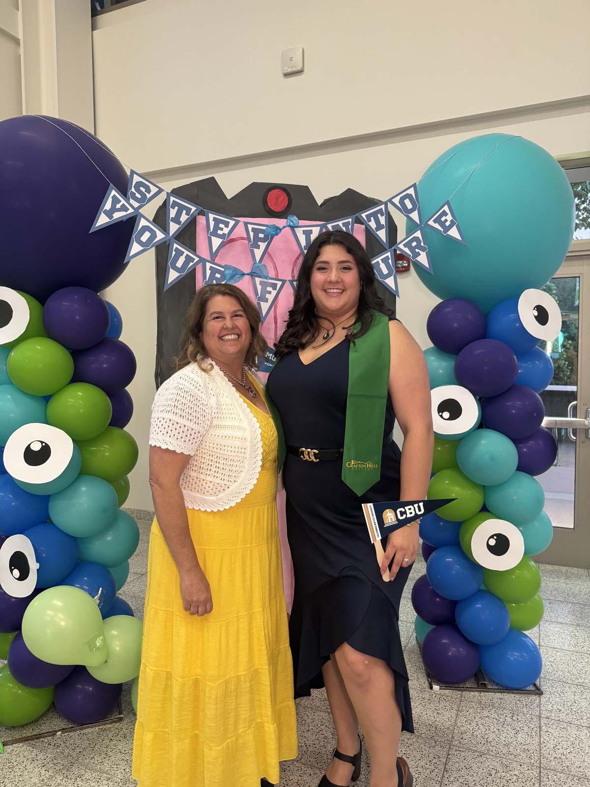 Students attend Transfer Dinner celebration with mascot Ryker.