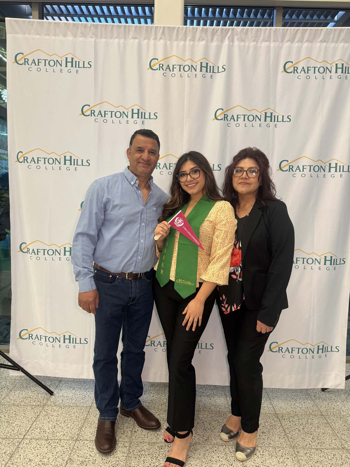 Students attend Transfer Dinner celebration with mascot Ryker.