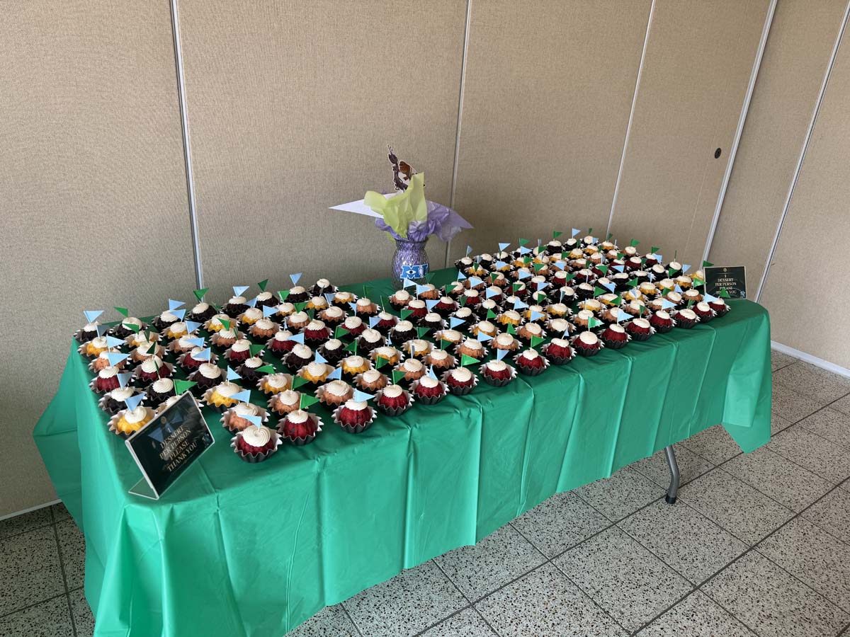 Students attend Transfer Dinner celebration with mascot Ryker.