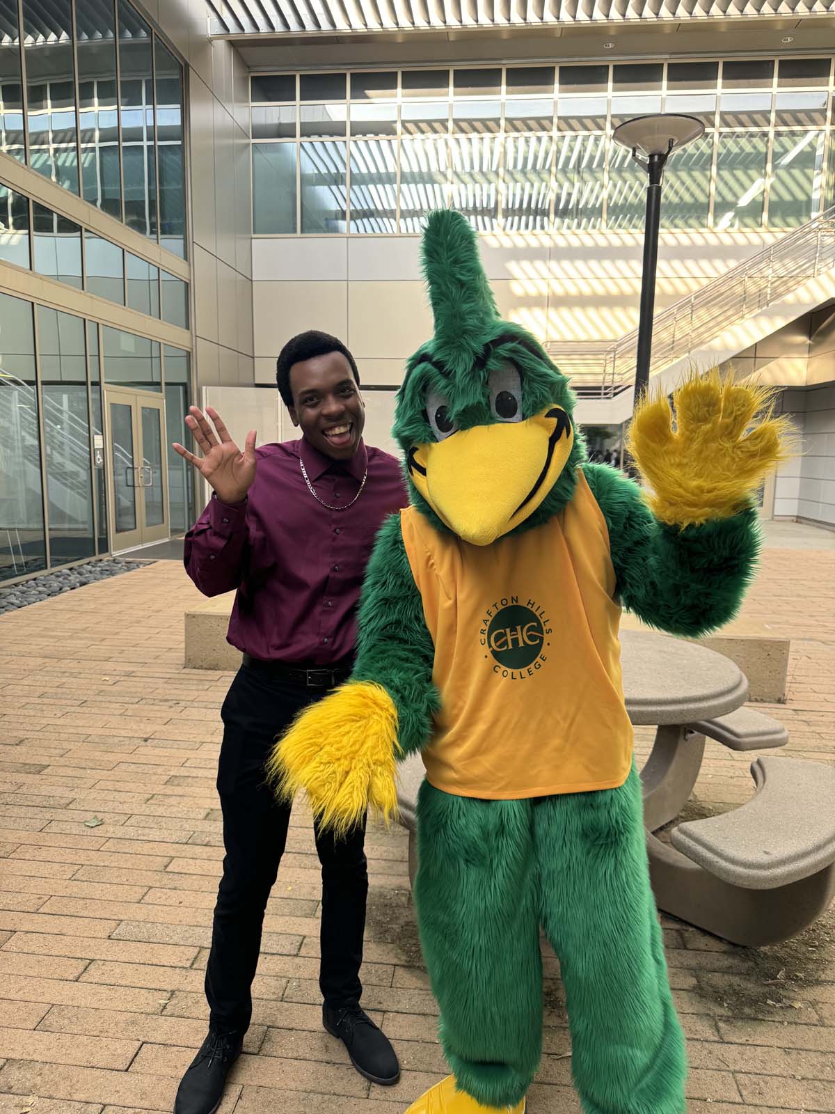 Students attend Transfer Dinner celebration with mascot Ryker.