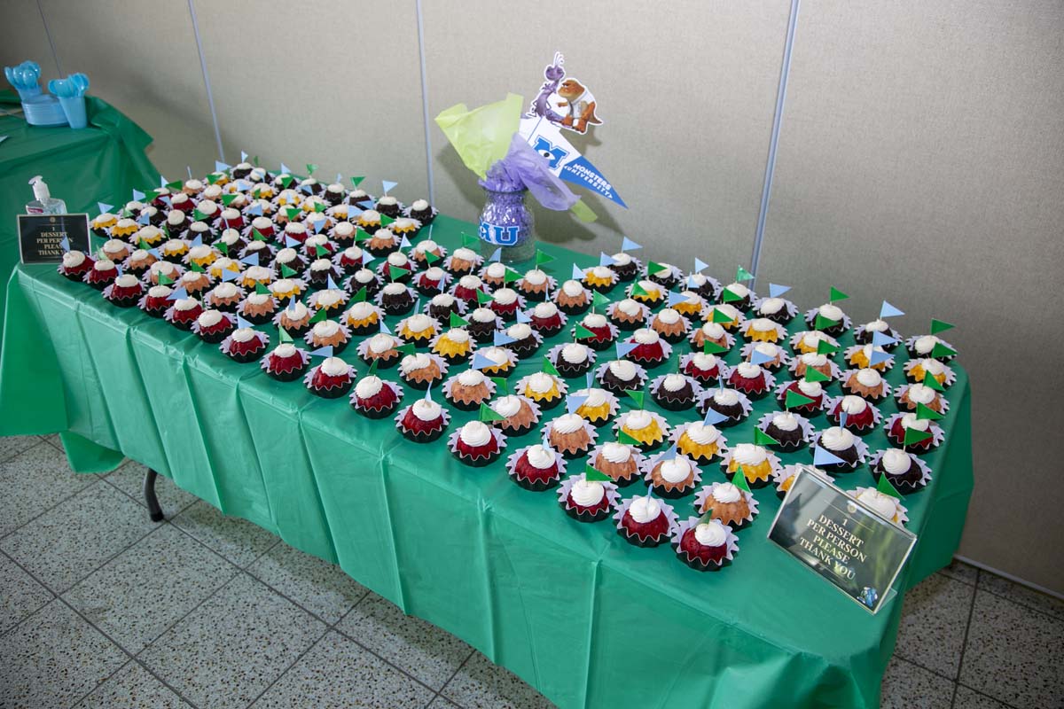 Students attend Transfer Dinner celebration with mascot Ryker.