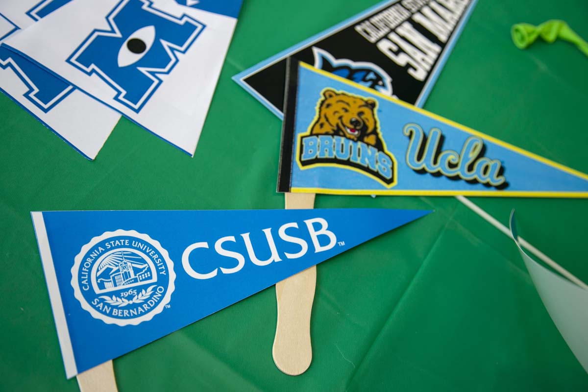 Students attend Transfer Dinner celebration with mascot Ryker.