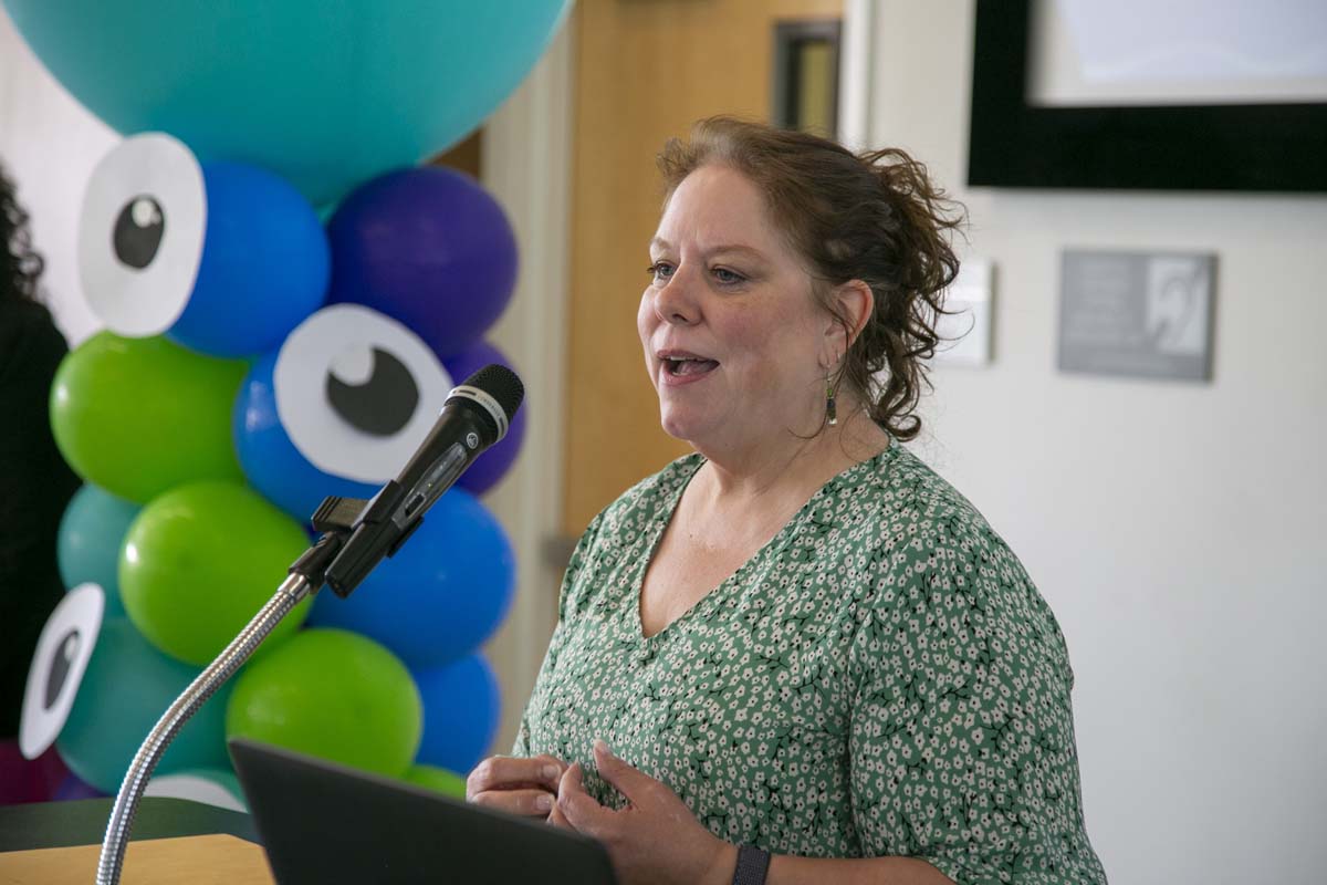 Students attend Transfer Dinner celebration with mascot Ryker.
