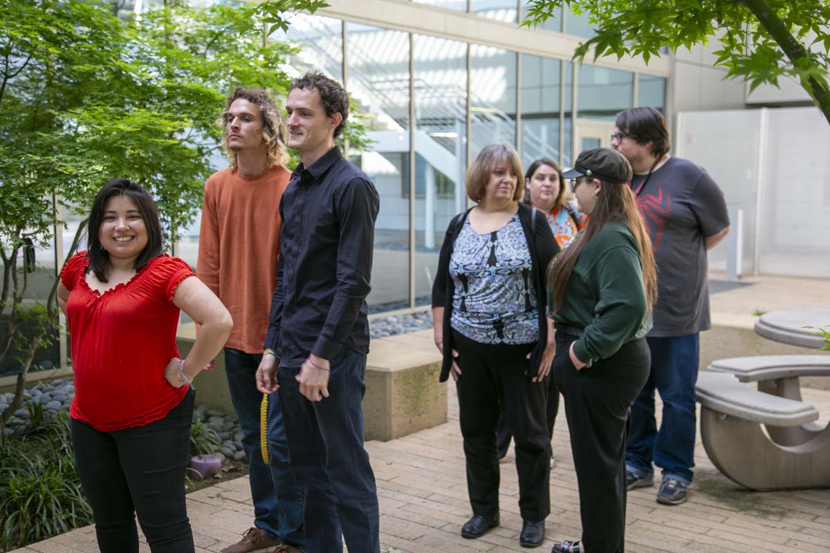Students attend Transfer Dinner celebration with mascot Ryker.