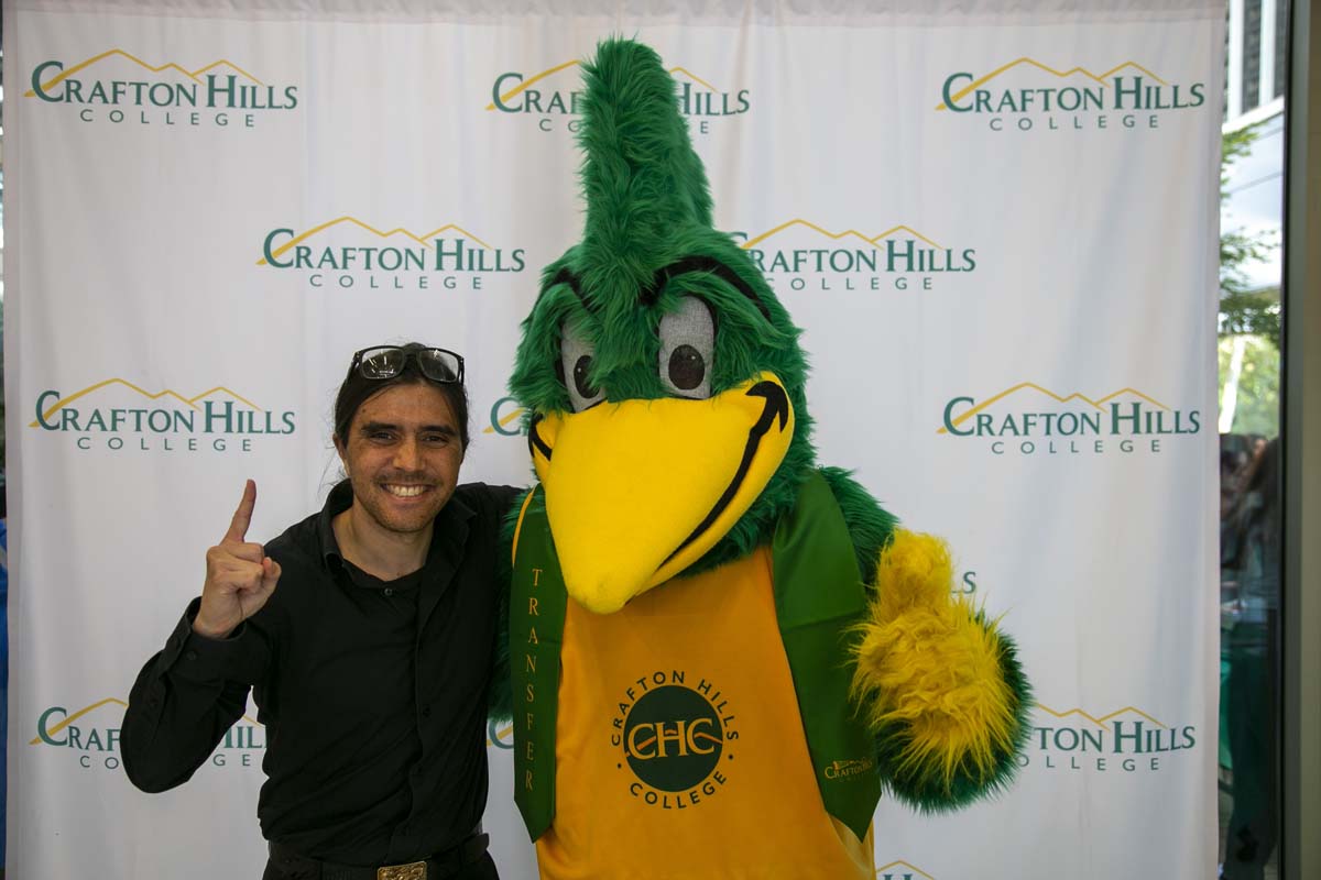 Students attend Transfer Dinner celebration with mascot Ryker.