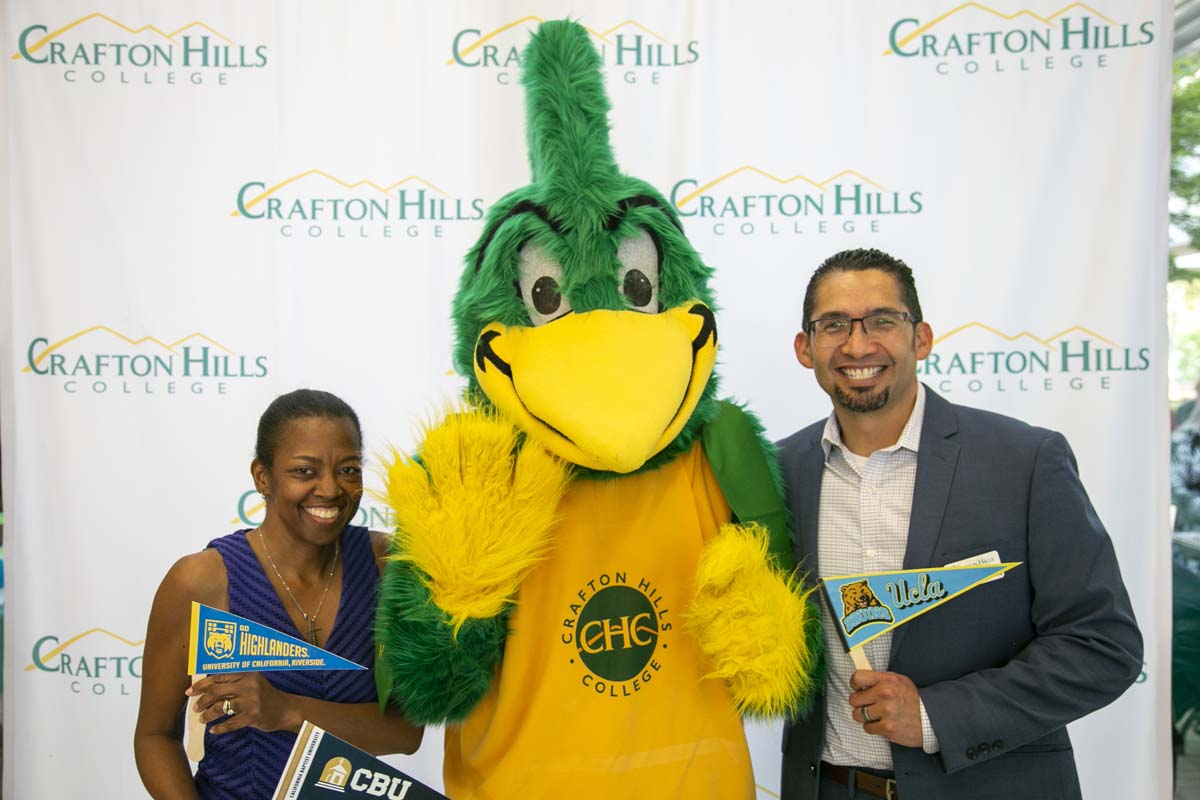 Students attend Transfer Dinner celebration with mascot Ryker.