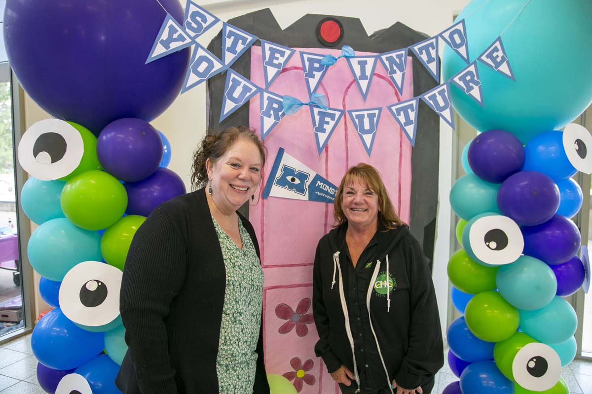 Students attend Transfer Dinner celebration with mascot Ryker.