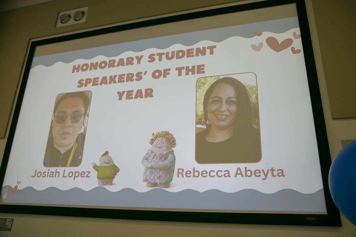 Students attend Transfer Dinner celebration with mascot Ryker.