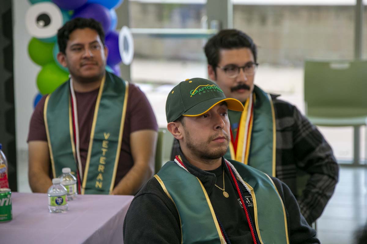 Students attend Transfer Dinner celebration with mascot Ryker.