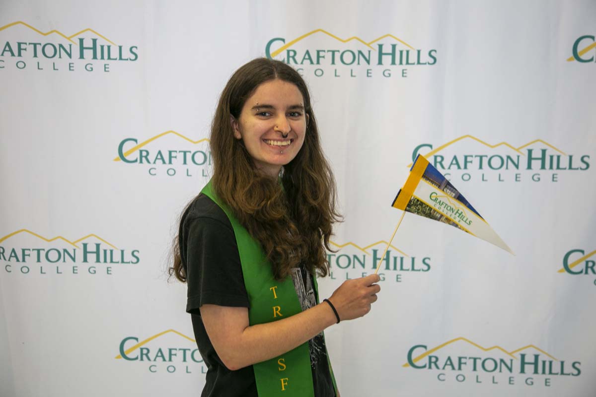 Students attend Transfer Dinner celebration with mascot Ryker.