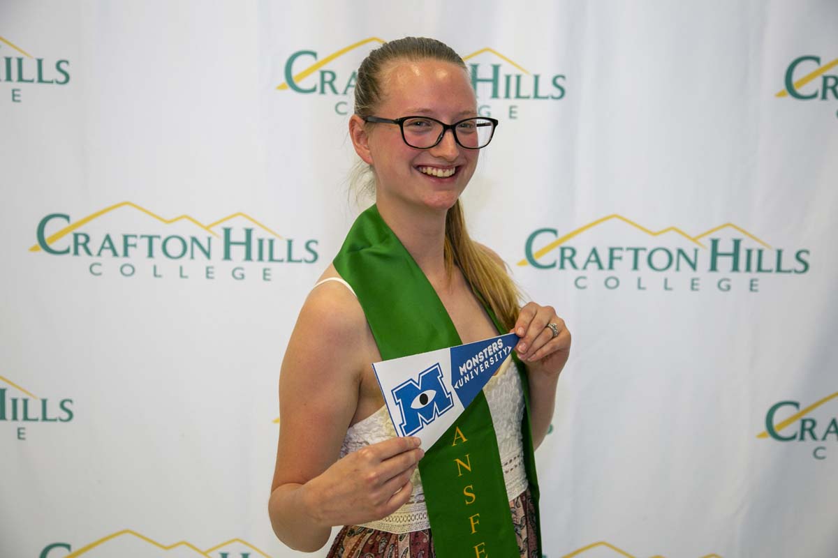 Students attend Transfer Dinner celebration with mascot Ryker.