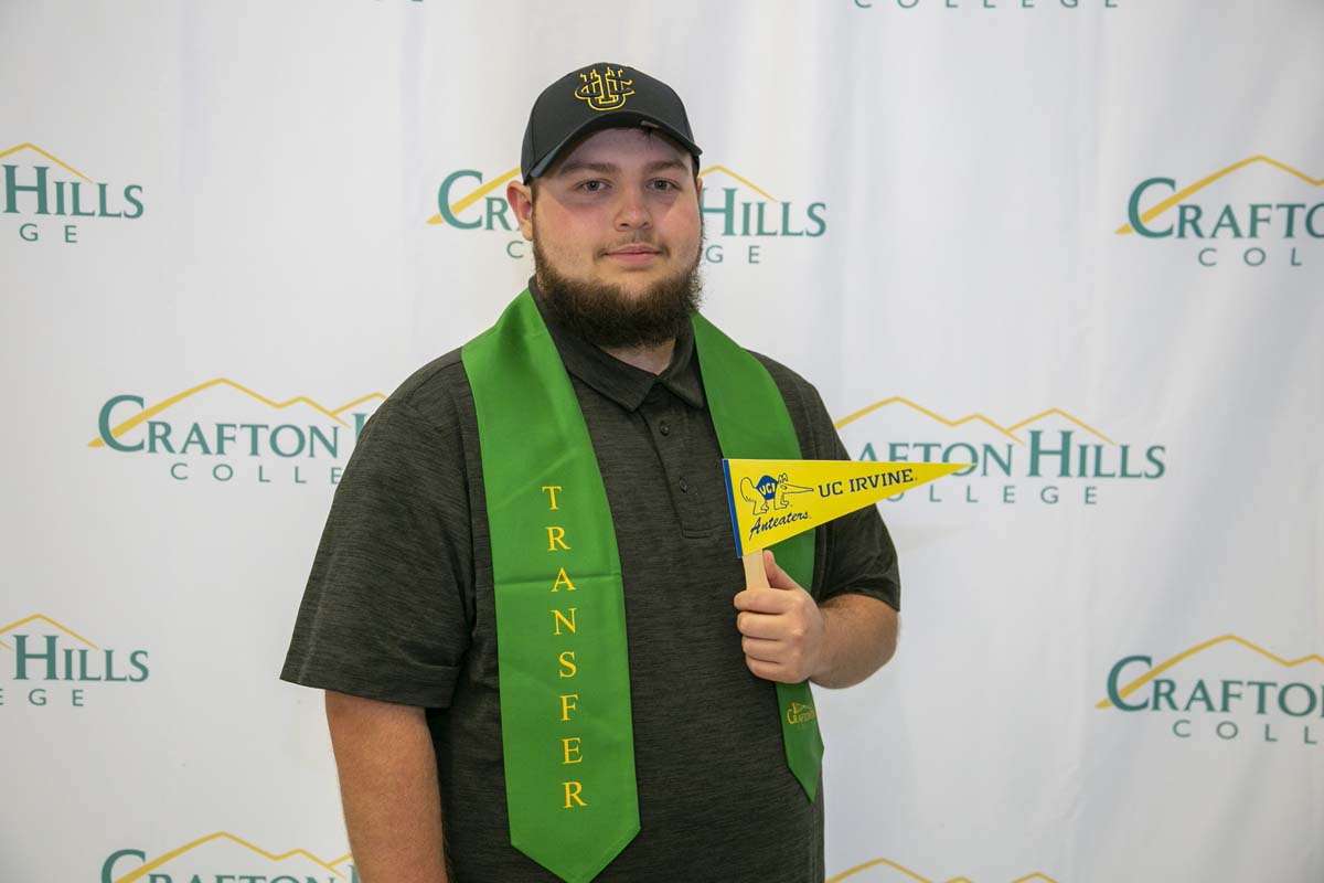 Students attend Transfer Dinner celebration with mascot Ryker.
