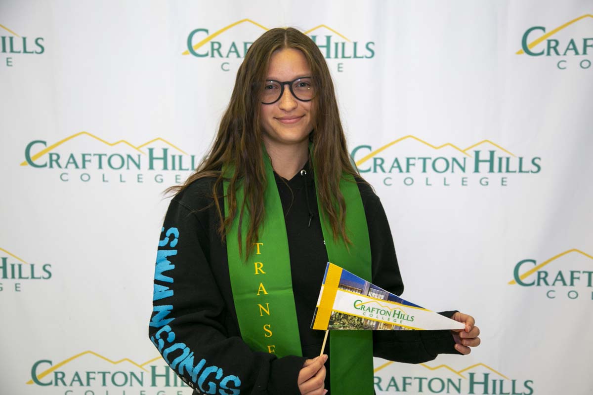 Students attend Transfer Dinner celebration with mascot Ryker.