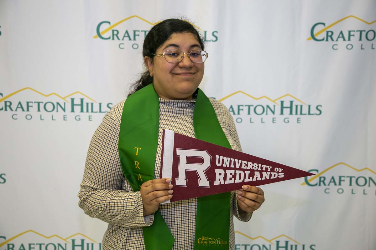 Students attend Transfer Dinner celebration with mascot Ryker.
