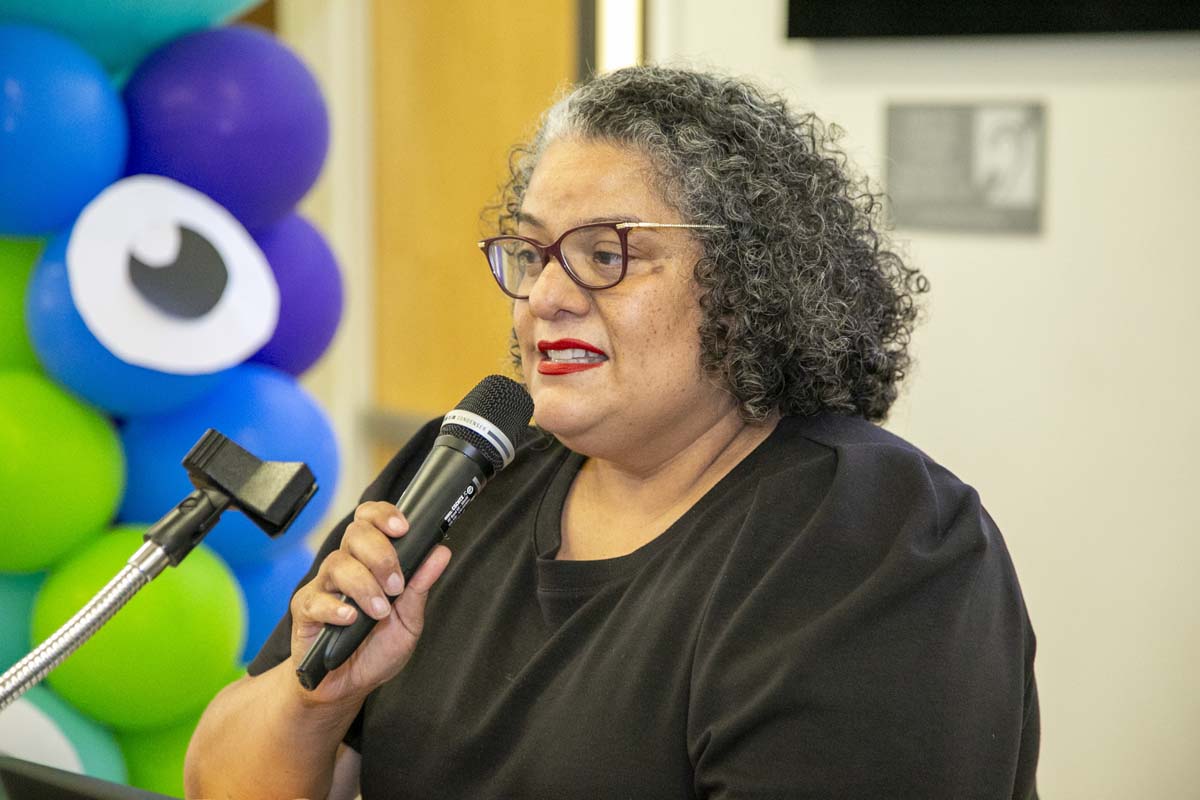 Students attend Transfer Dinner celebration with mascot Ryker.