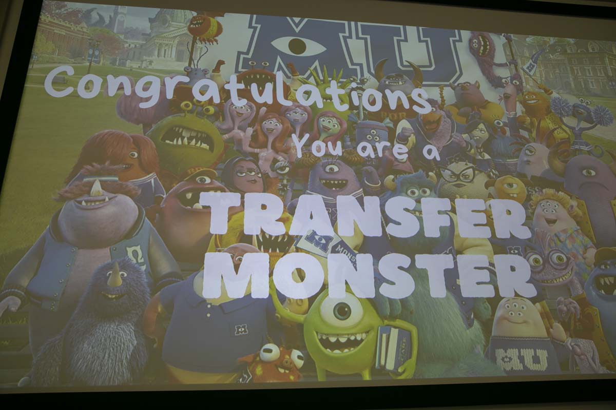 Students attend Transfer Dinner celebration with mascot Ryker.