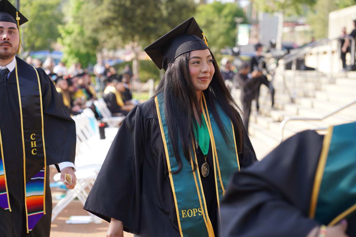 Graduates walk to stage at CHC's Commencement 2024.