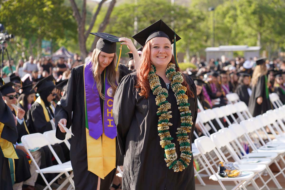 Graduates walk to stage at CHC's Commencement 2024.
