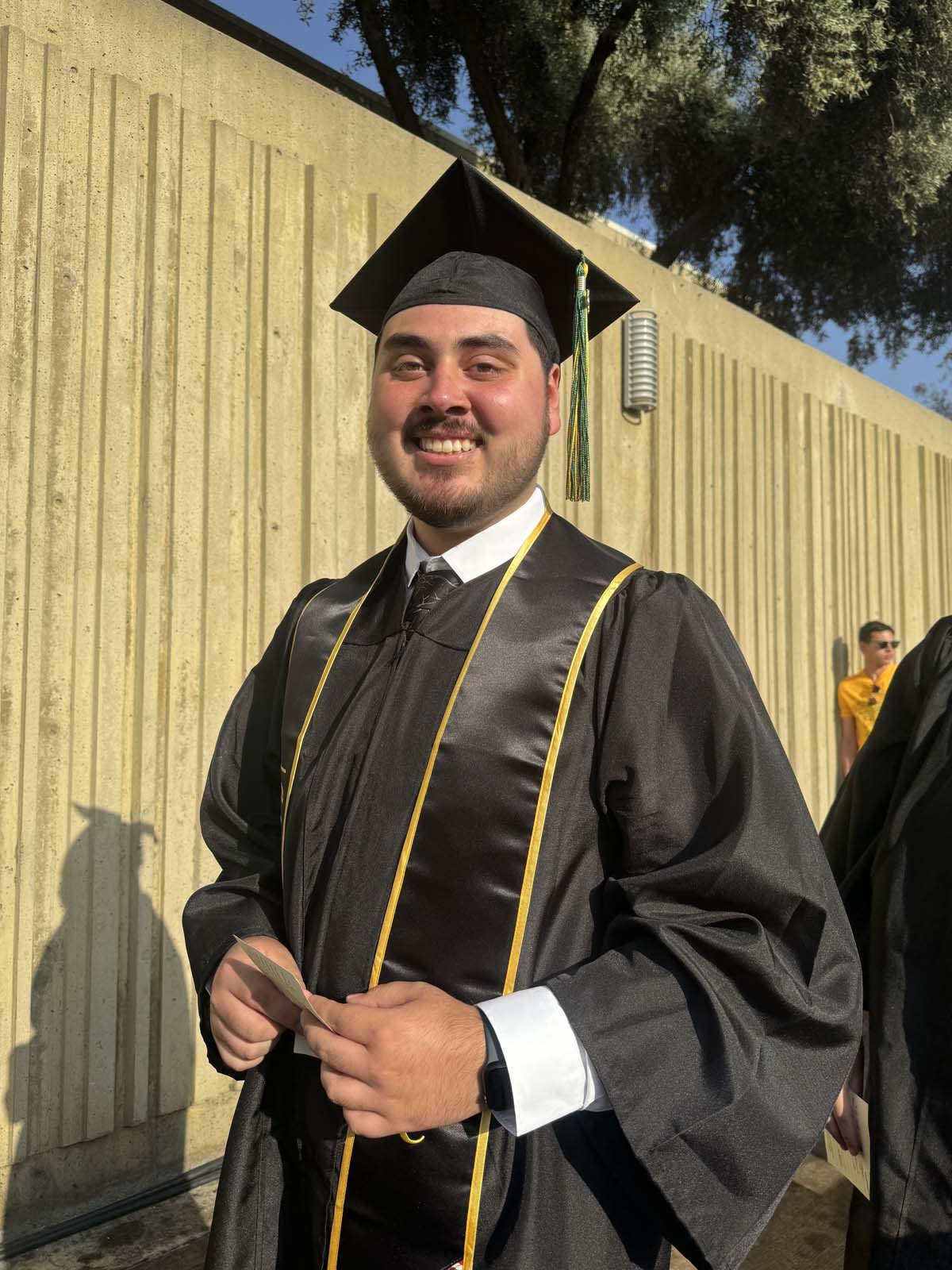 Graduates walk to stage at CHC's Commencement 2024.