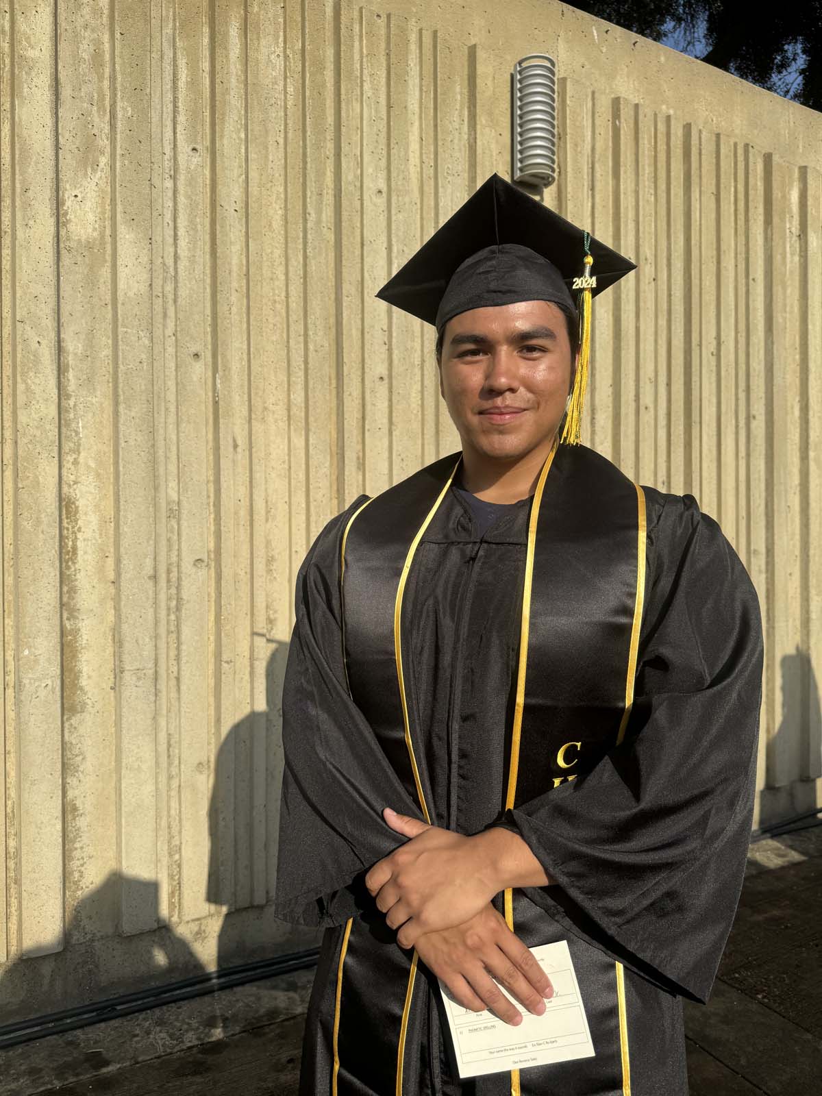 Graduates walk to stage at CHC's Commencement 2024.