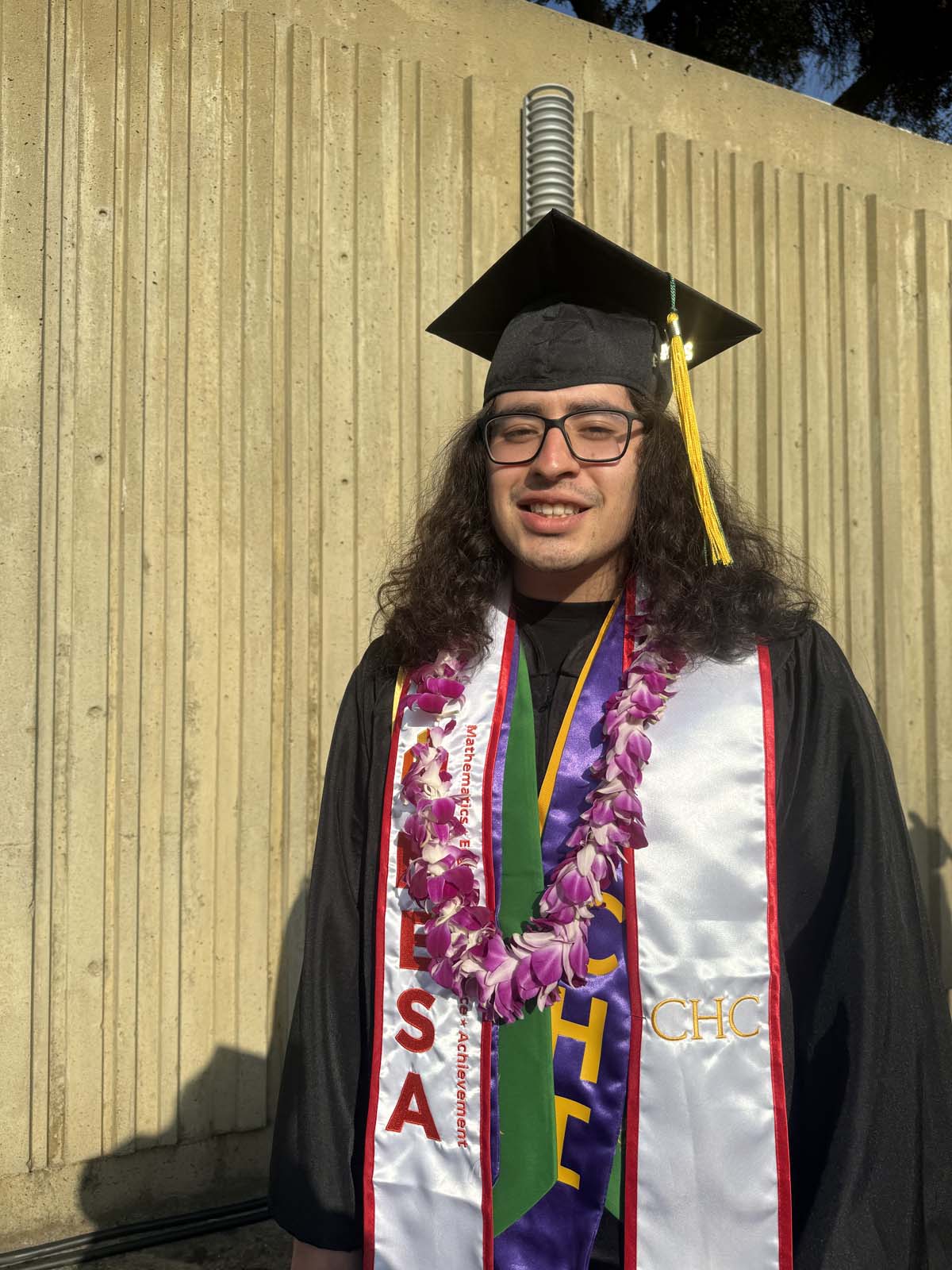 Graduates walk to stage at CHC's Commencement 2024.