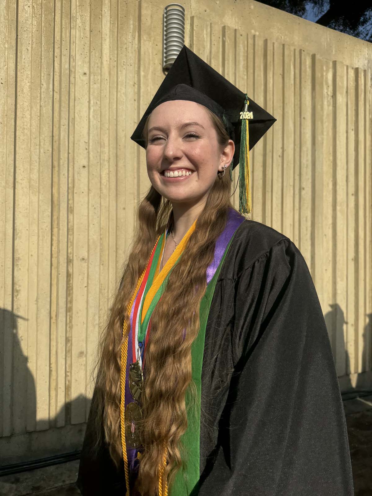 Graduates walk to stage at CHC's Commencement 2024.