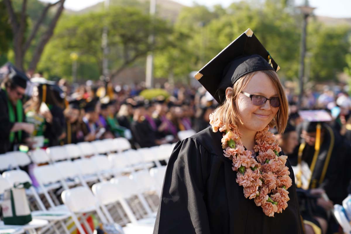Graduates walk to stage at CHC's Commencement 2024.