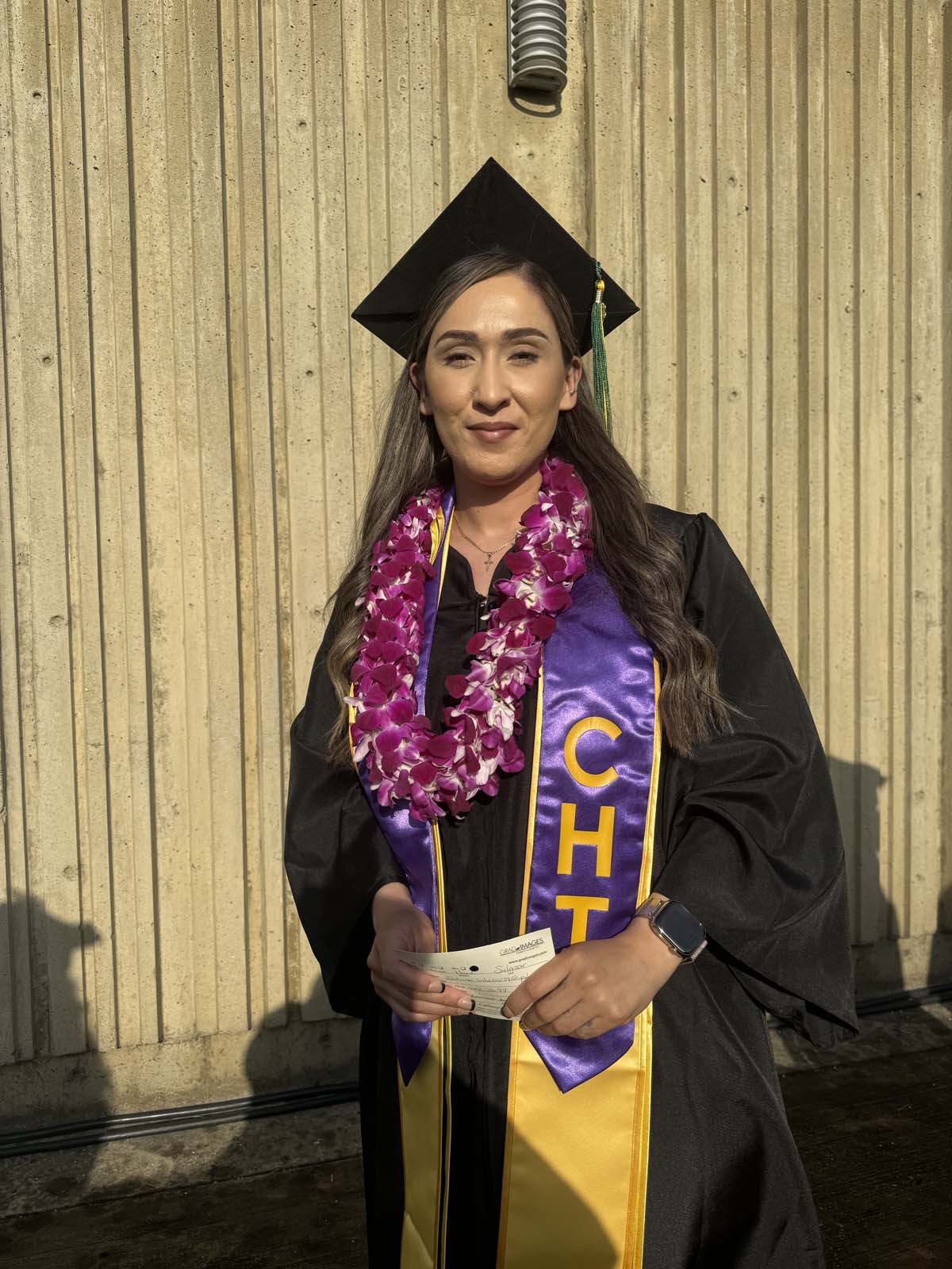 Graduates walk to stage at CHC's Commencement 2024.