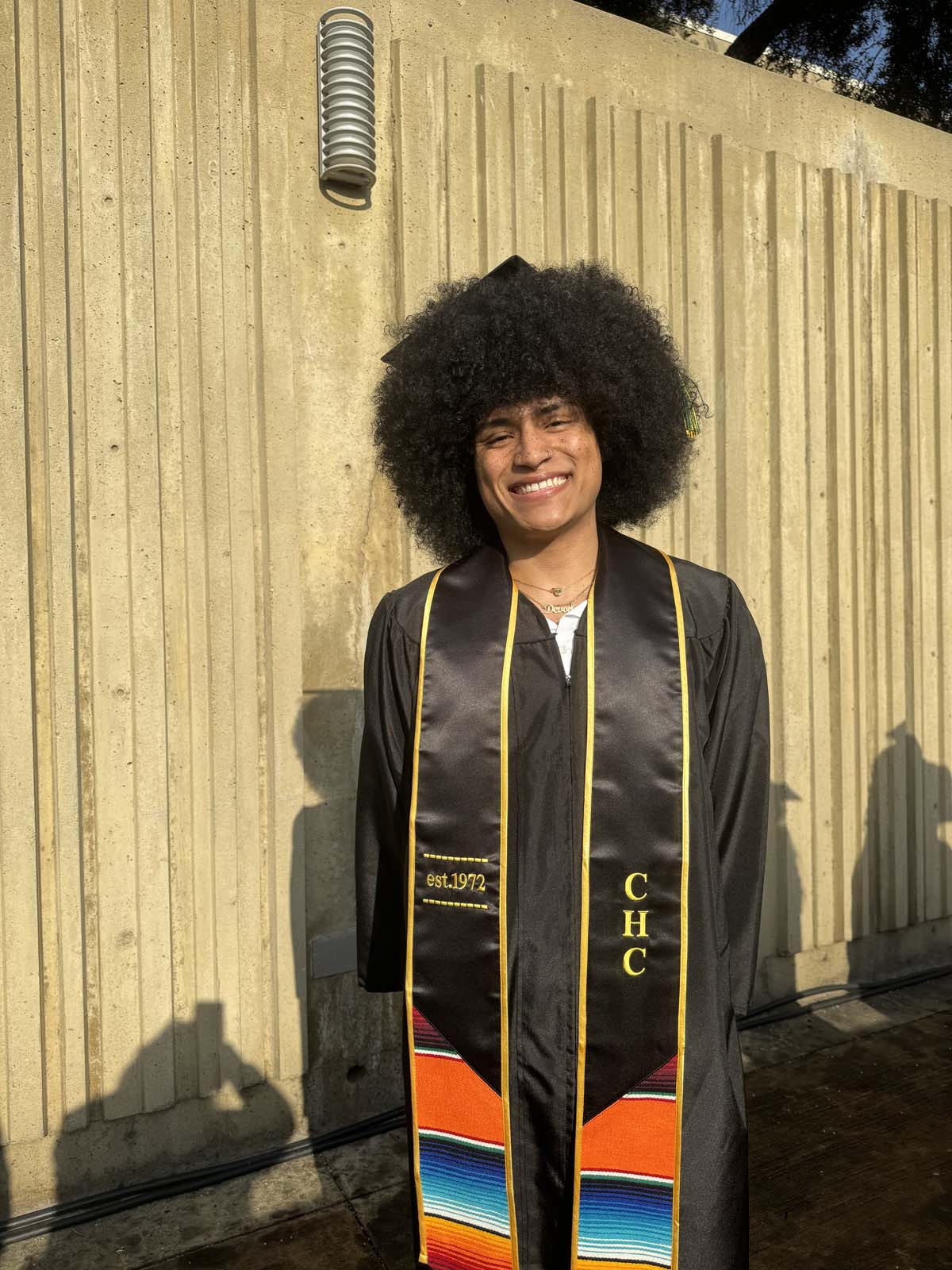 Graduates walk to stage at CHC's Commencement 2024.
