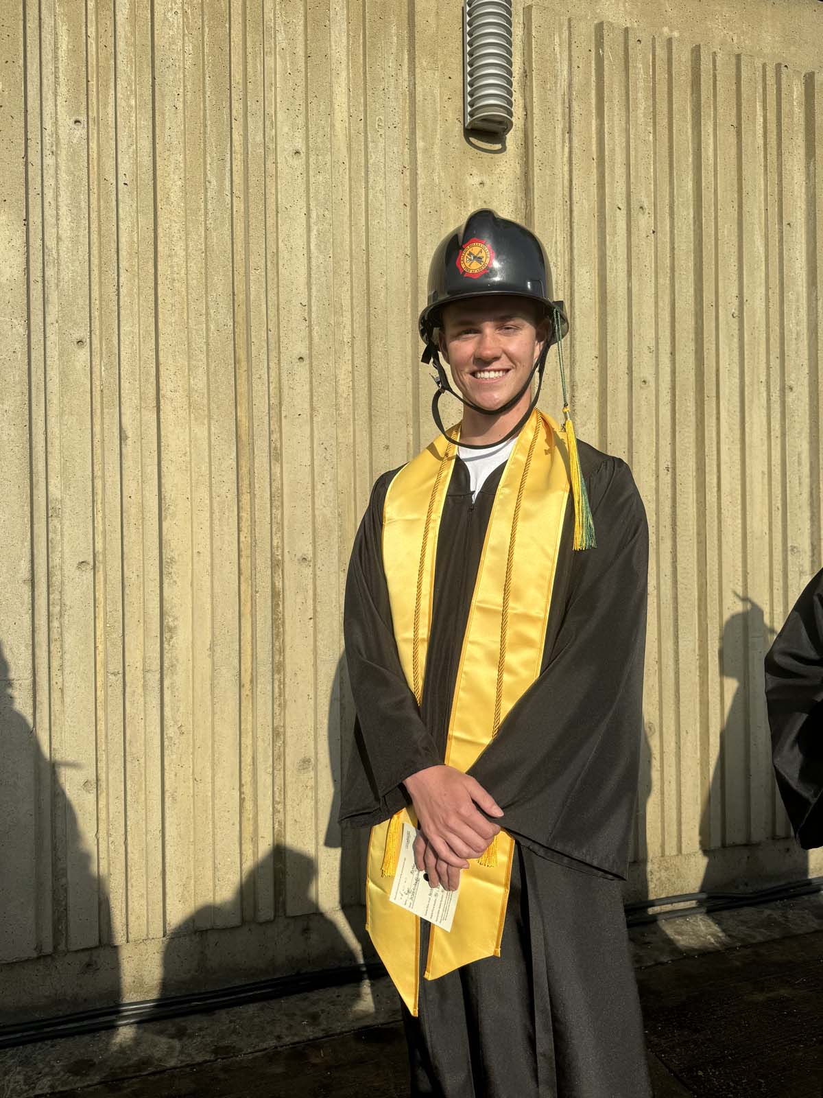 Graduates walk to stage at CHC's Commencement 2024.