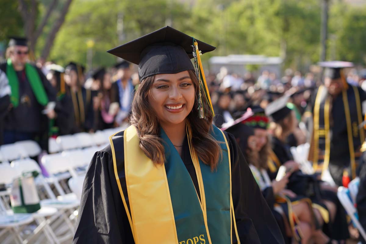 Graduates walk to stage at CHC's Commencement 2024.