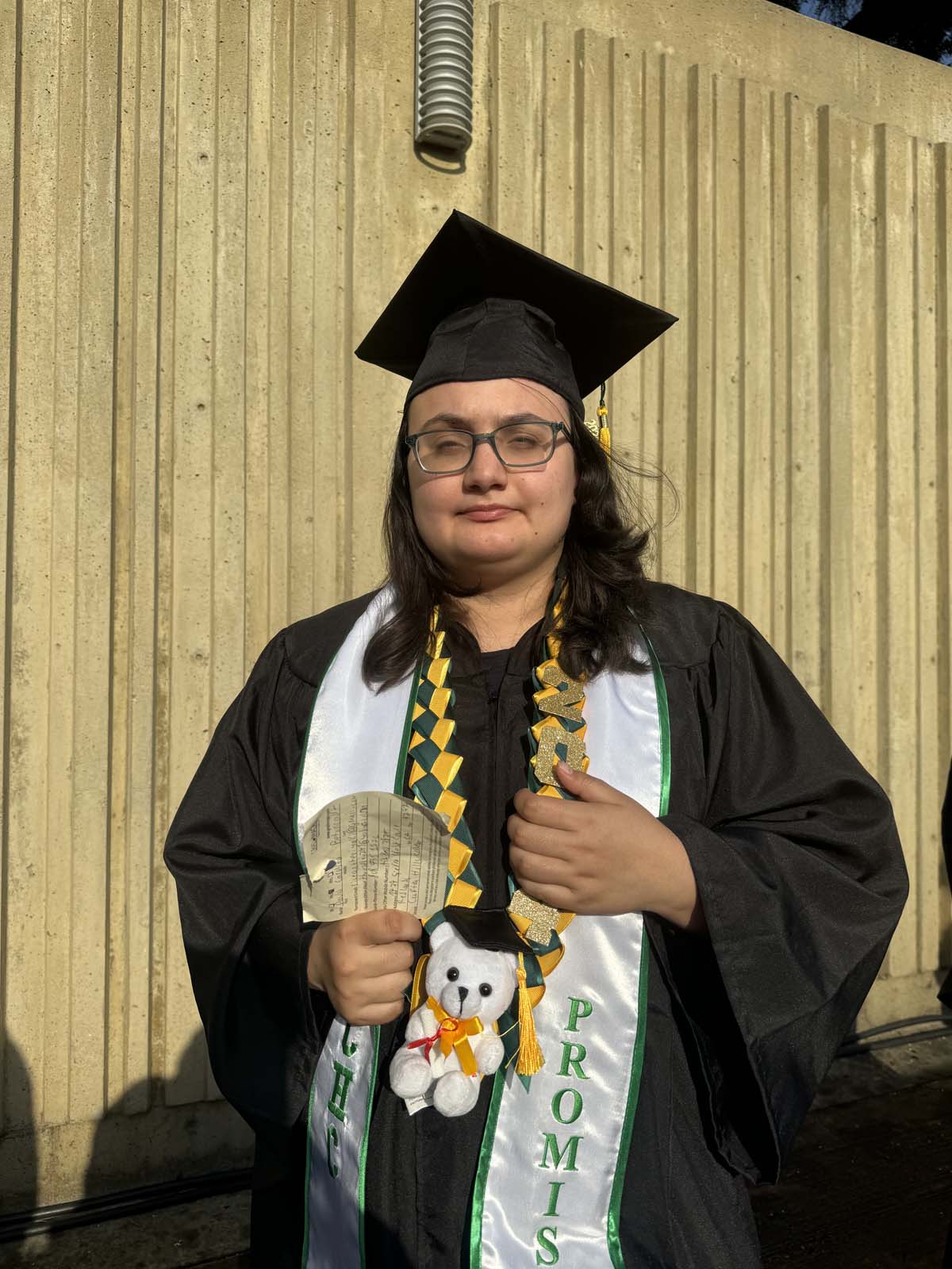 Graduates walk to stage at CHC's Commencement 2024.