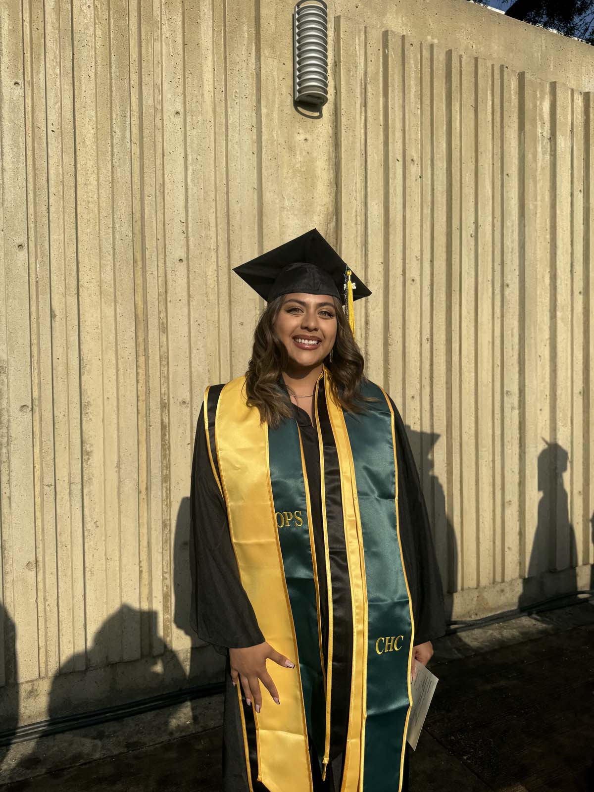 Graduates walk to stage at CHC's Commencement 2024.