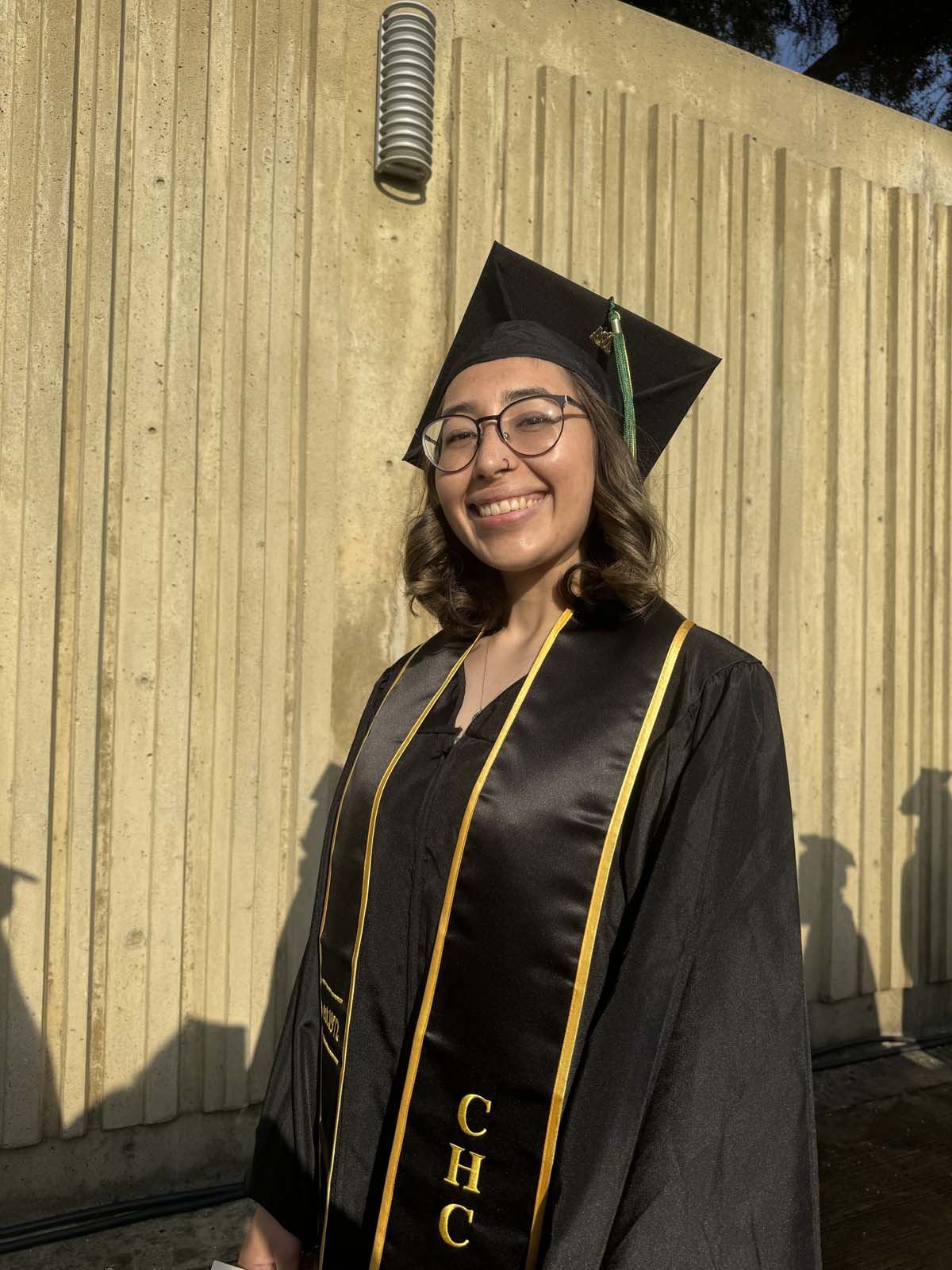Graduates walk to stage at CHC's Commencement 2024.