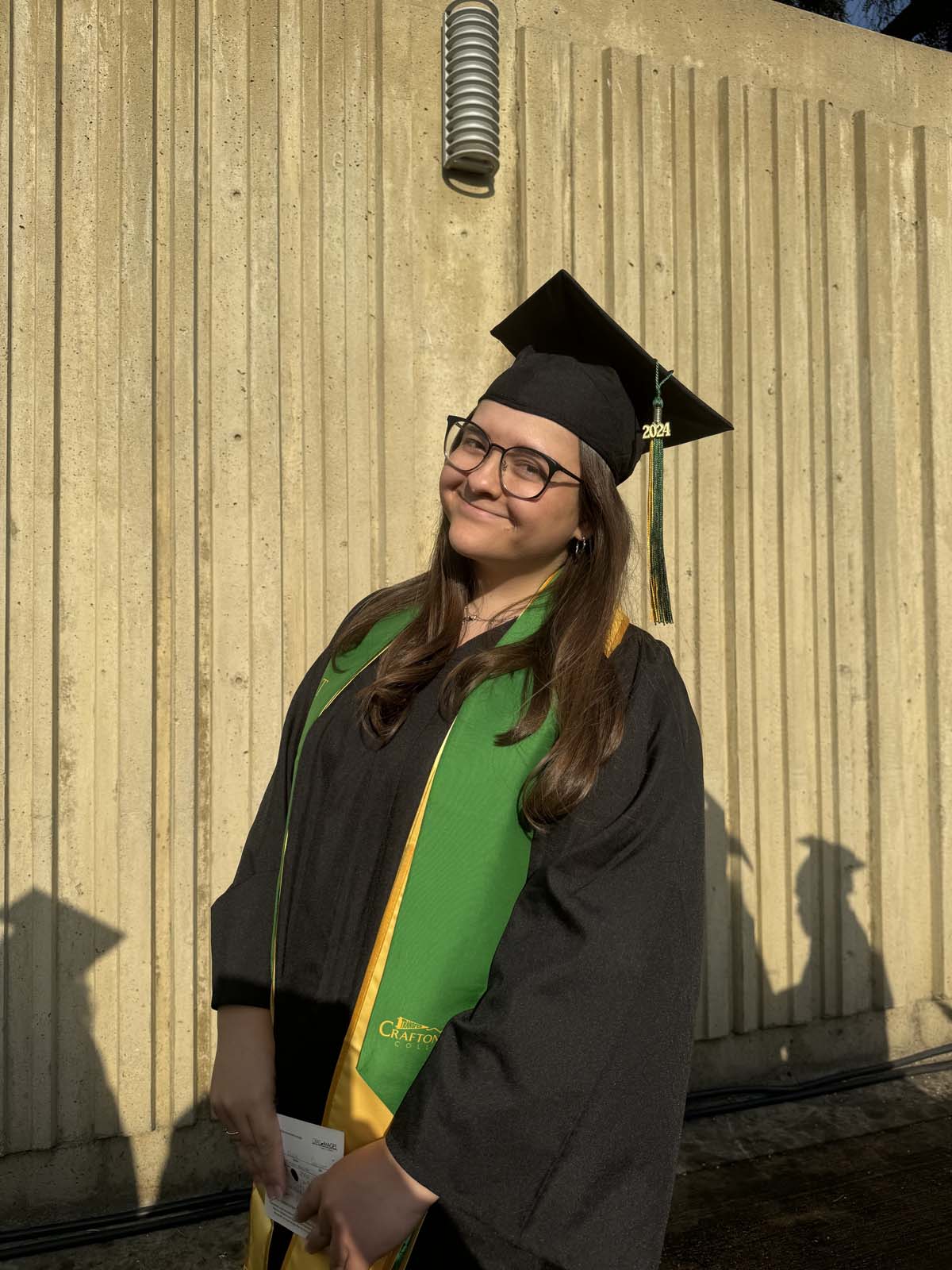 Graduates walk to stage at CHC's Commencement 2024.