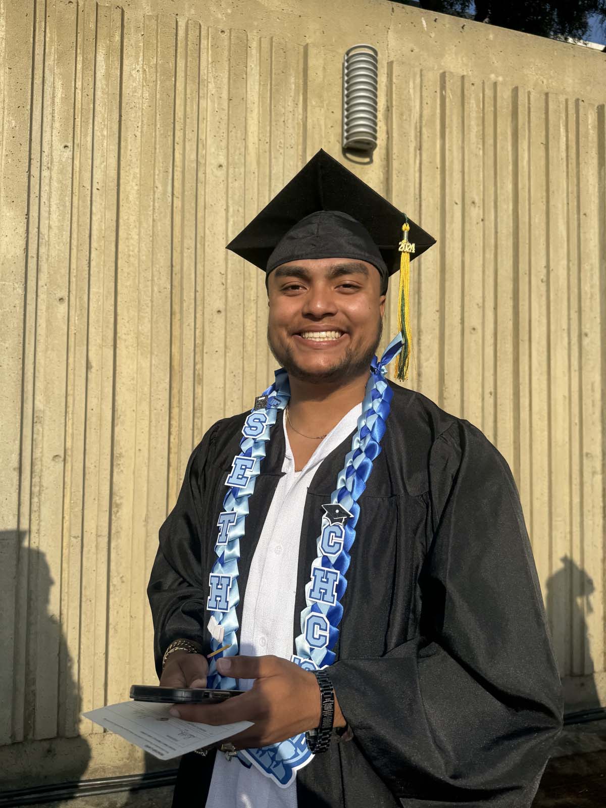 Graduates walk to stage at CHC's Commencement 2024.