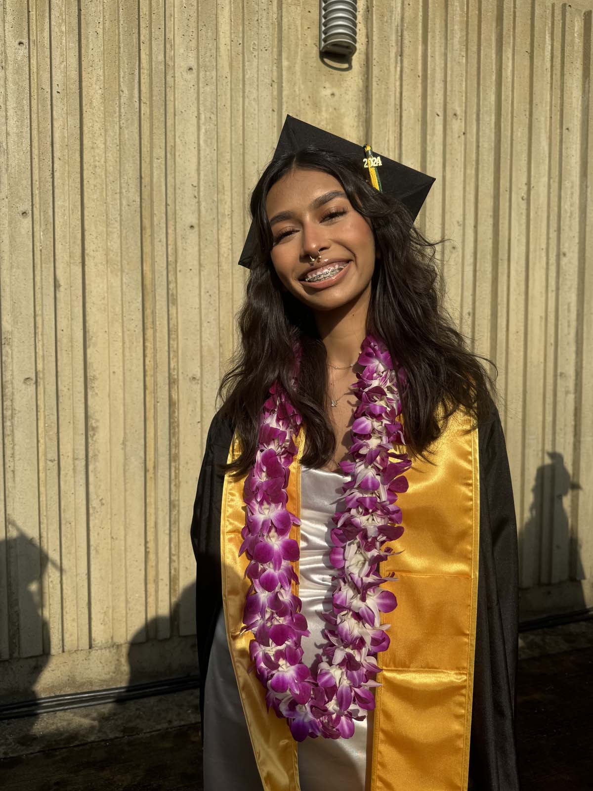 Graduates walk to stage at CHC's Commencement 2024.
