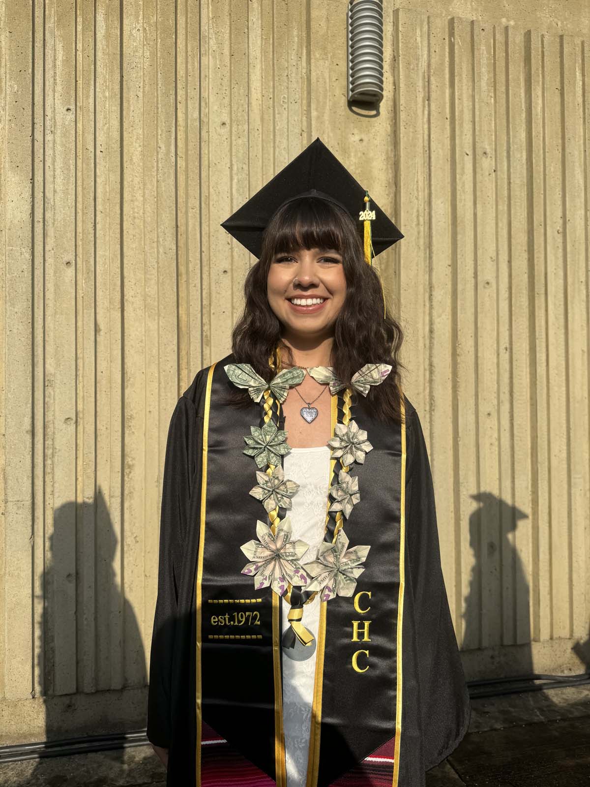 Graduates walk to stage at CHC's Commencement 2024.