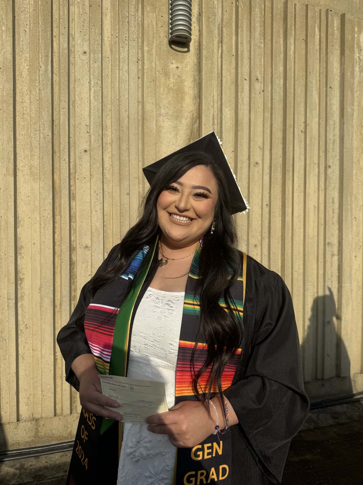 Graduates walk to stage at CHC's Commencement 2024.