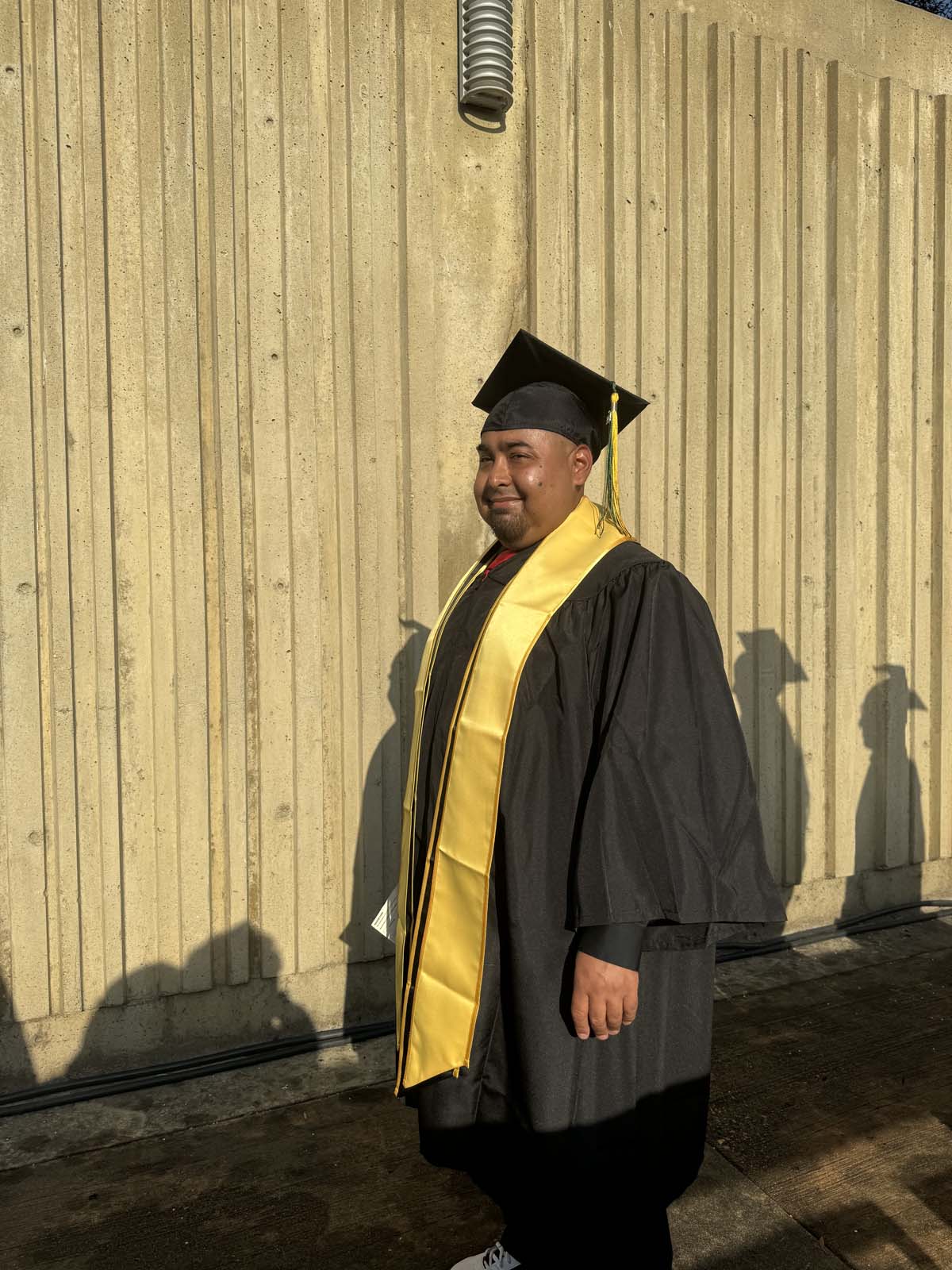 Graduates walk to stage at CHC's Commencement 2024.