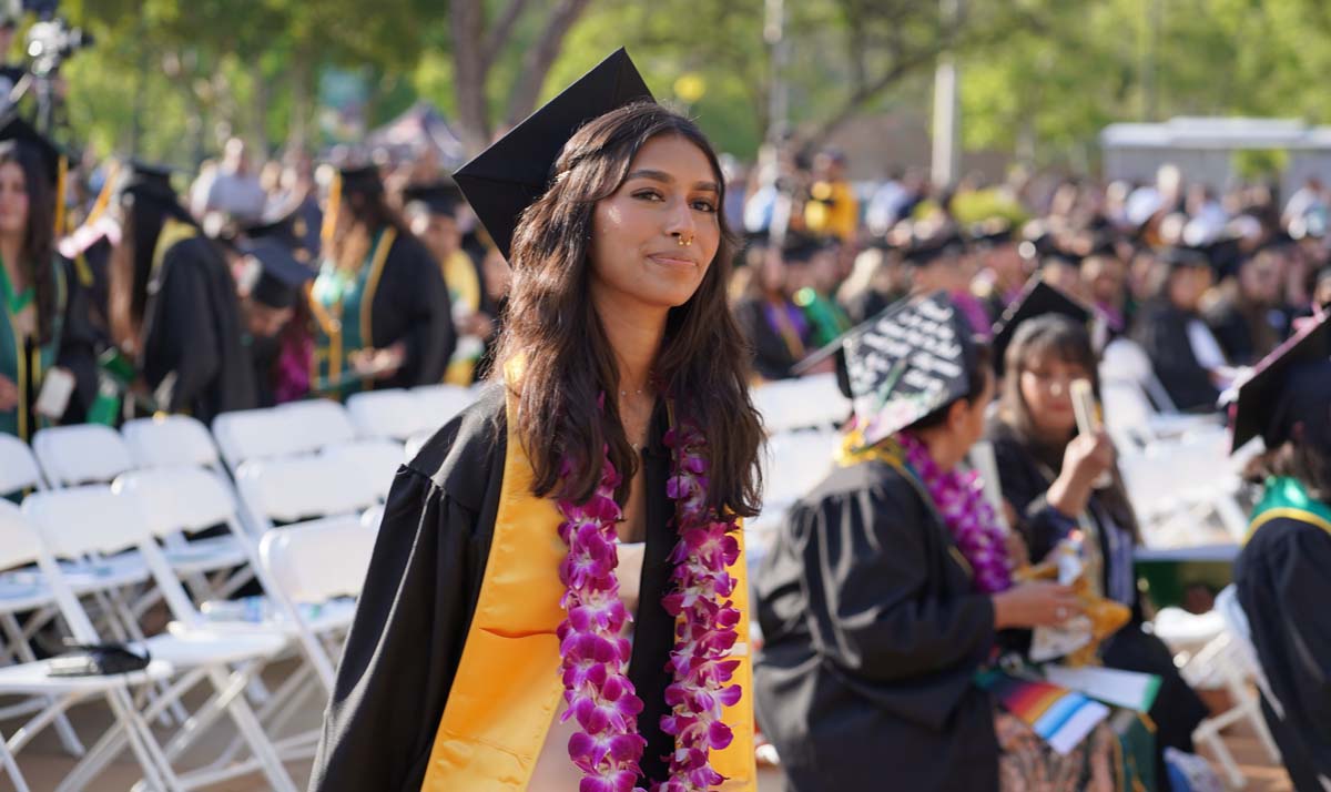 Graduates walk to stage at CHC's Commencement 2024.