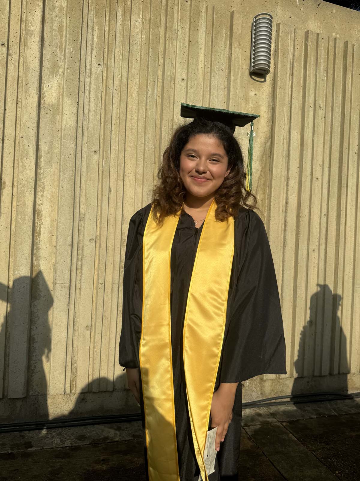 Graduates walk to stage at CHC's Commencement 2024.