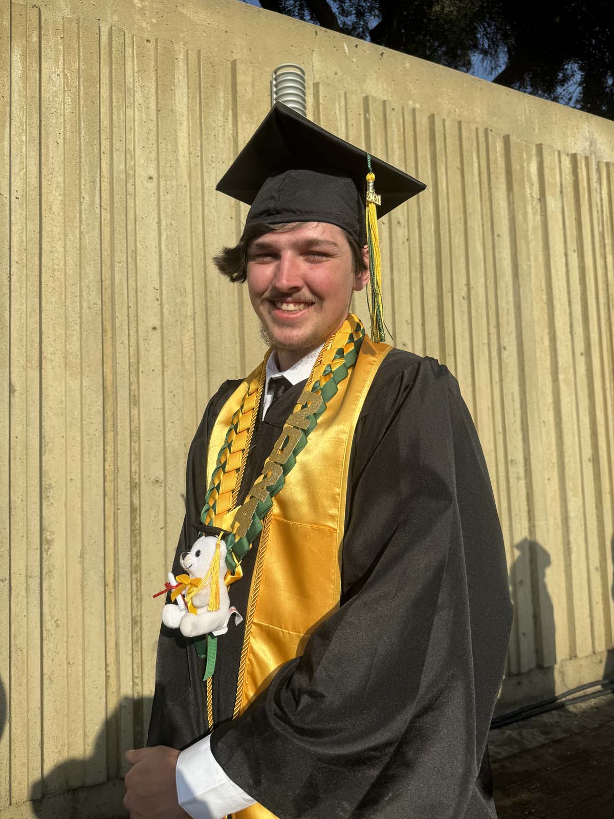 Graduates walk to stage at CHC's Commencement 2024.