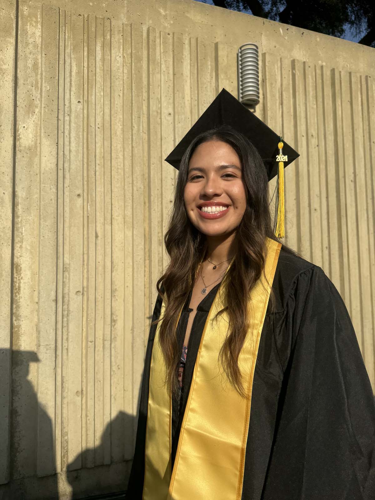 Graduates walk to stage at CHC's Commencement 2024.
