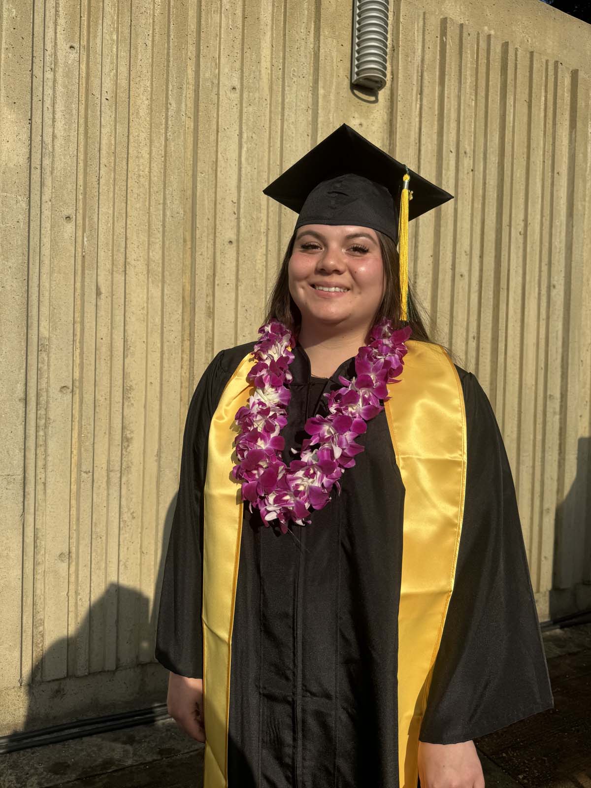 Graduates walk to stage at CHC's Commencement 2024.