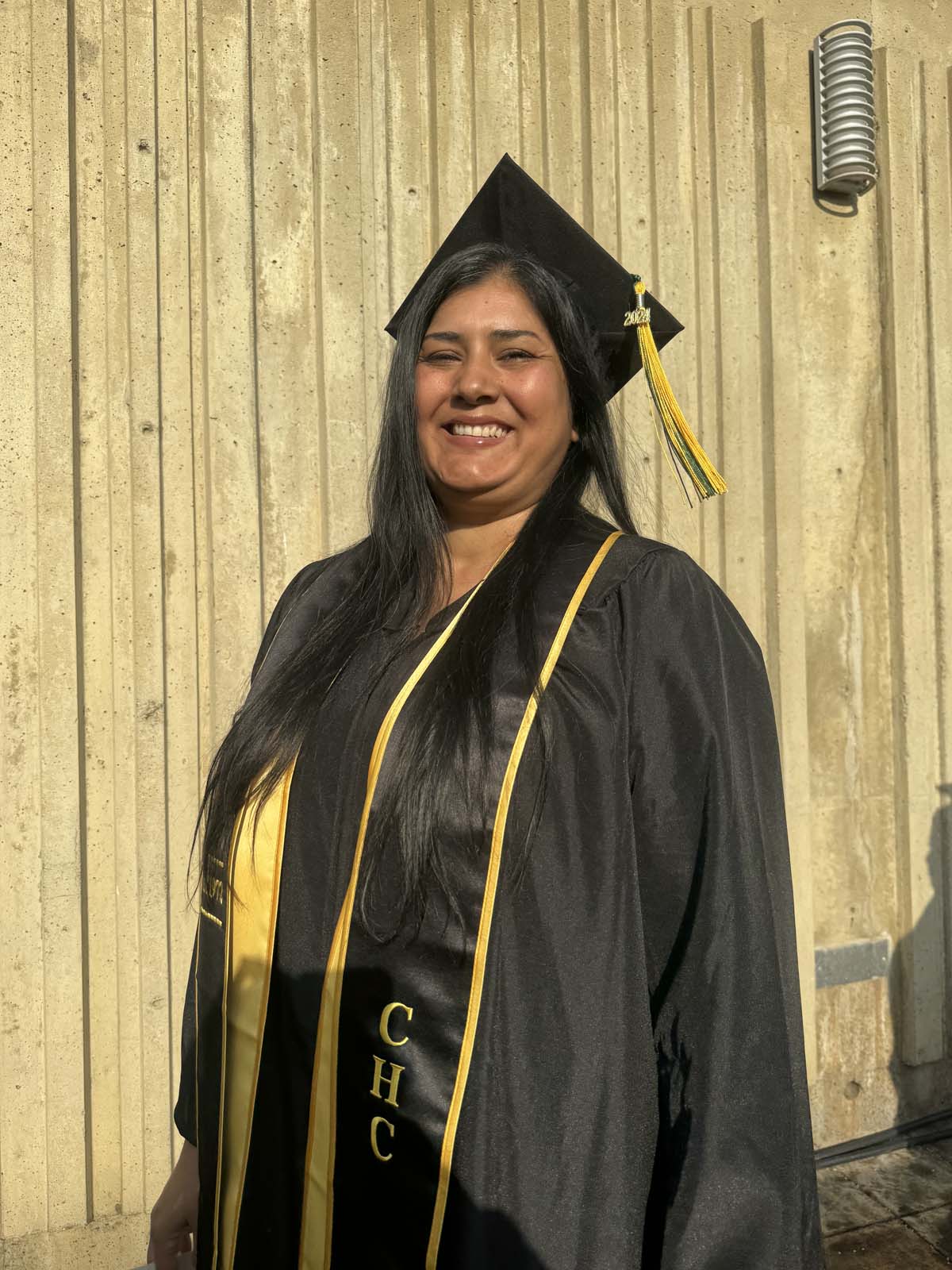 Graduates walk to stage at CHC's Commencement 2024.
