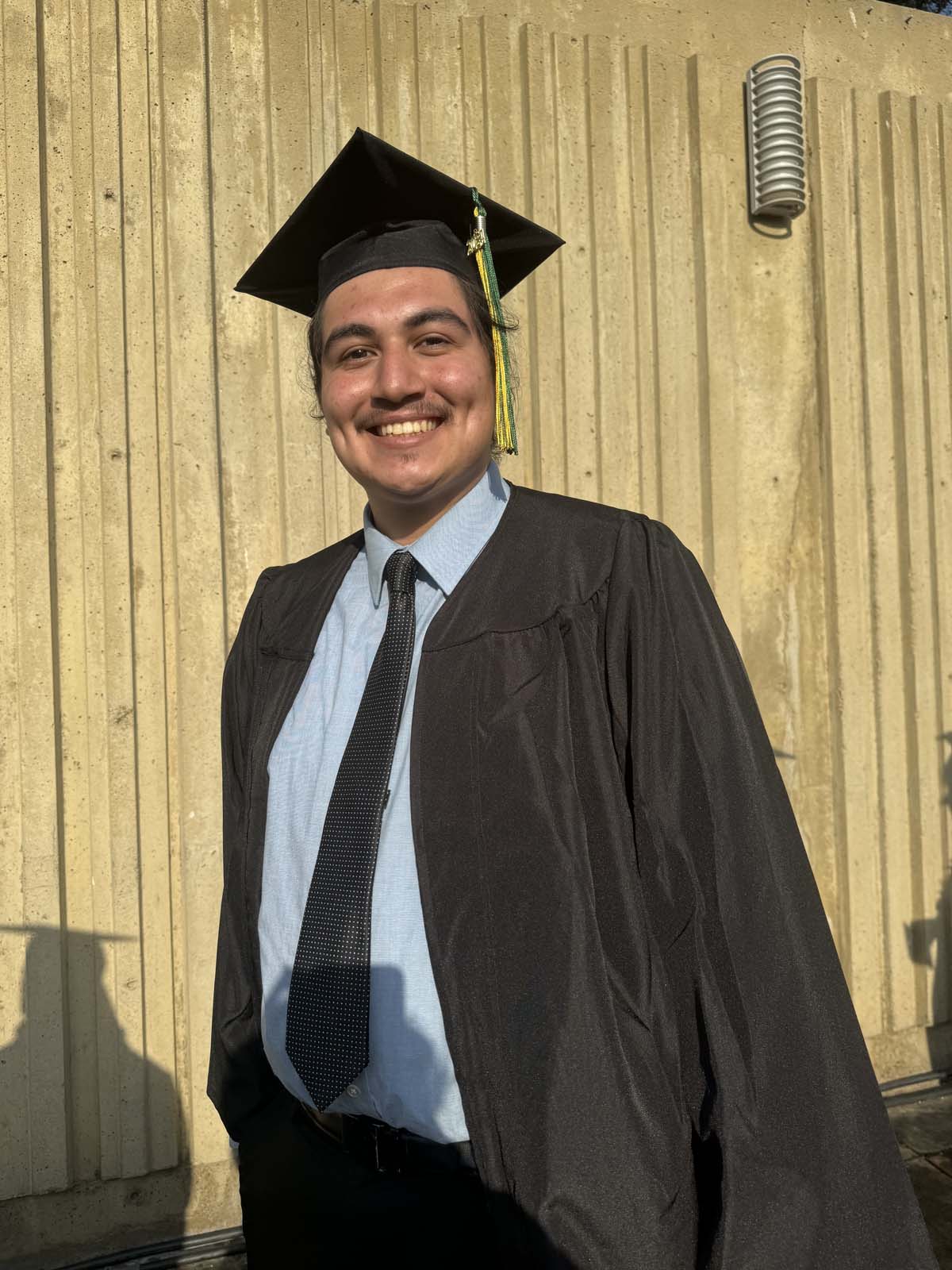 Graduates walk to stage at CHC's Commencement 2024.