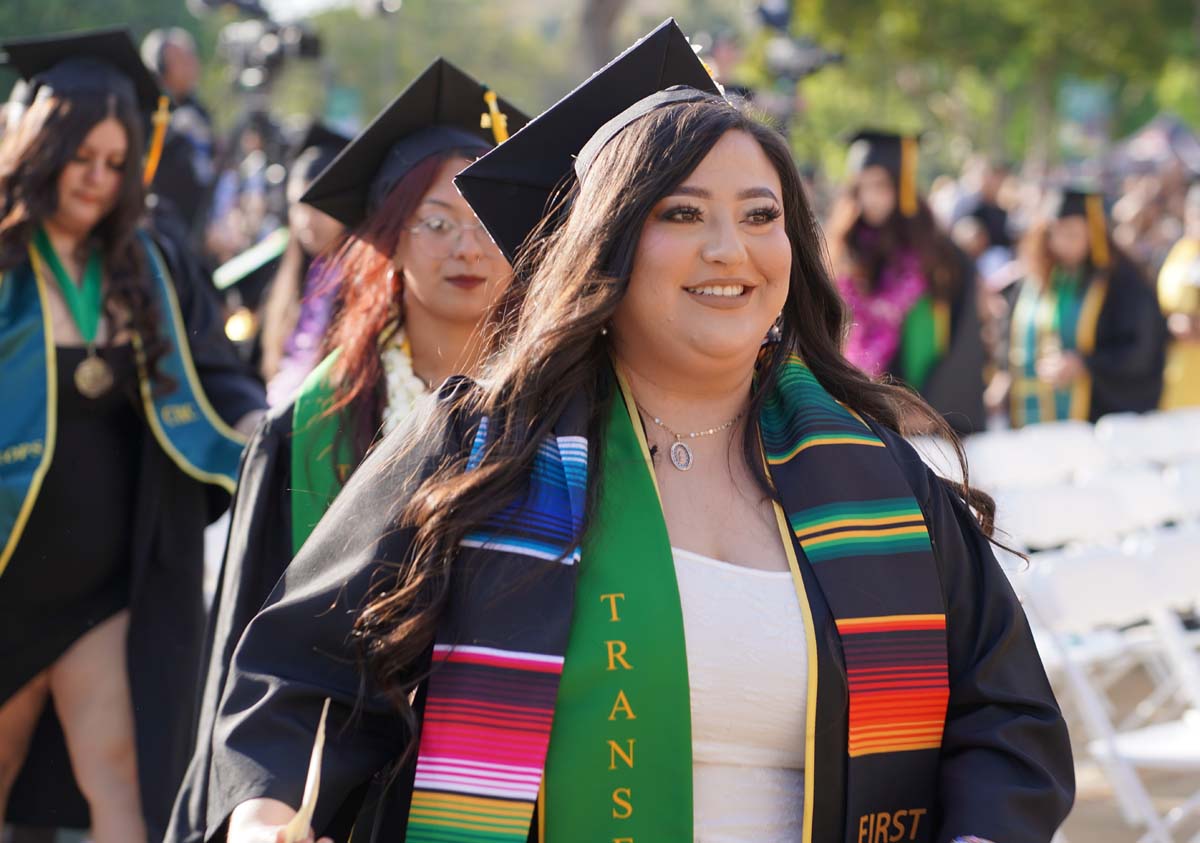 Graduates walk to stage at CHC's Commencement 2024.