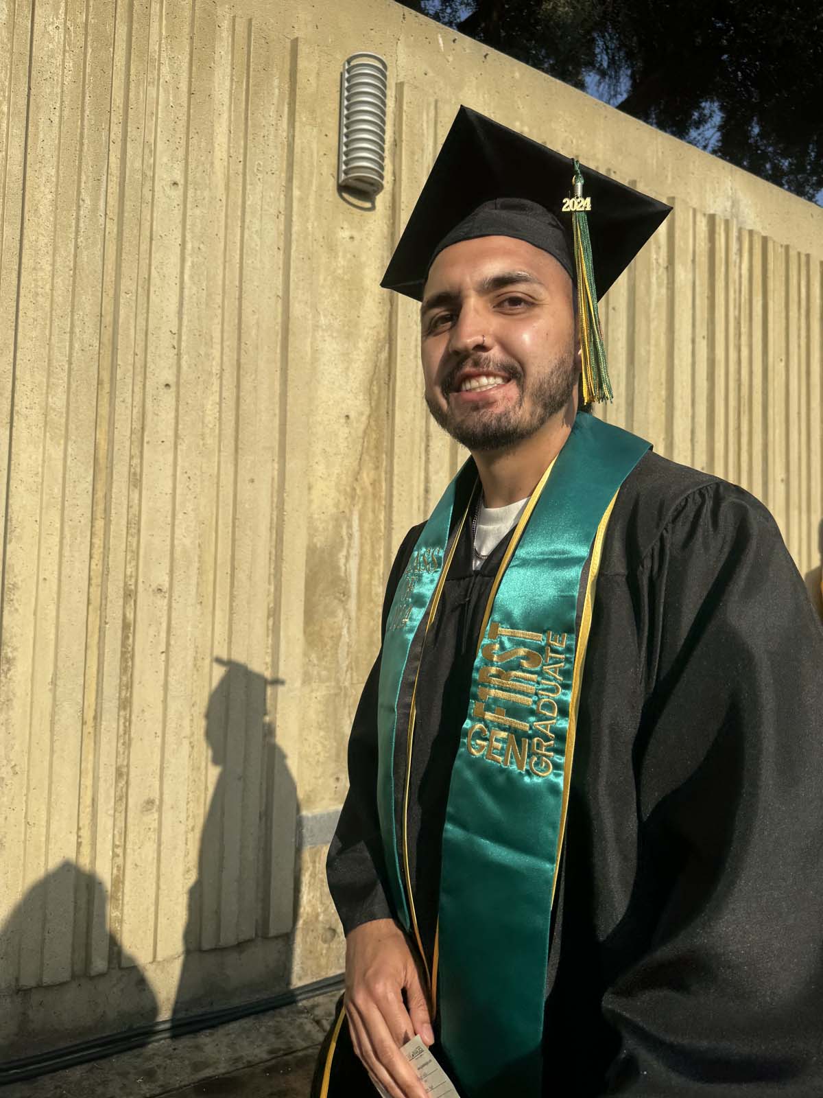 Graduates walk to stage at CHC's Commencement 2024.